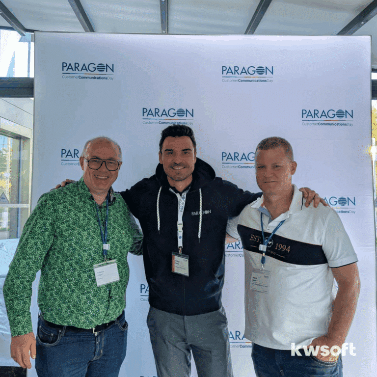 Volkmar Friauf, Philipp Moser and Marco Leven standing in front of the Paragon display at the Paragon Customer Communications Day 2025.
