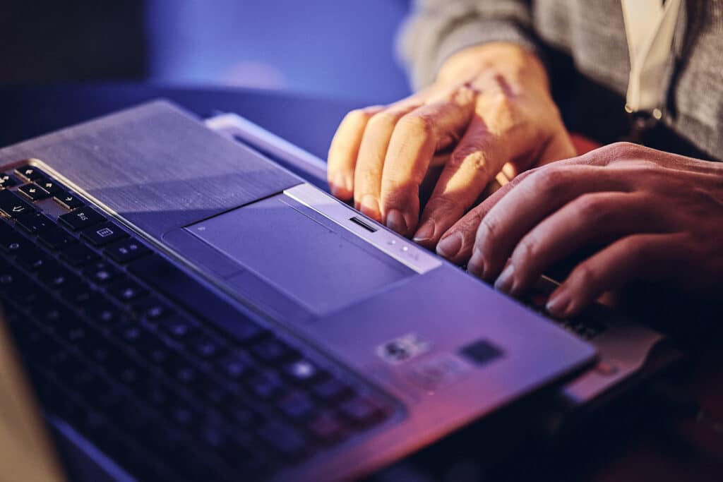 Man writes on Braille device