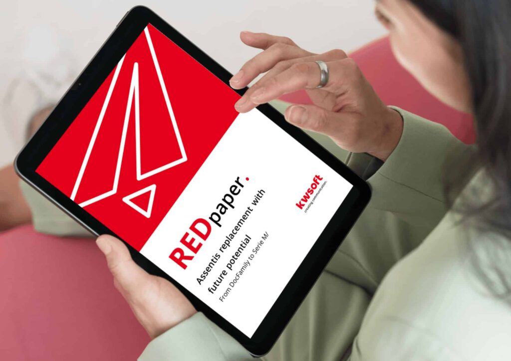 The image shows a tablet hold by someone which shows the cover of the REDpaper "Assentis Replacement"