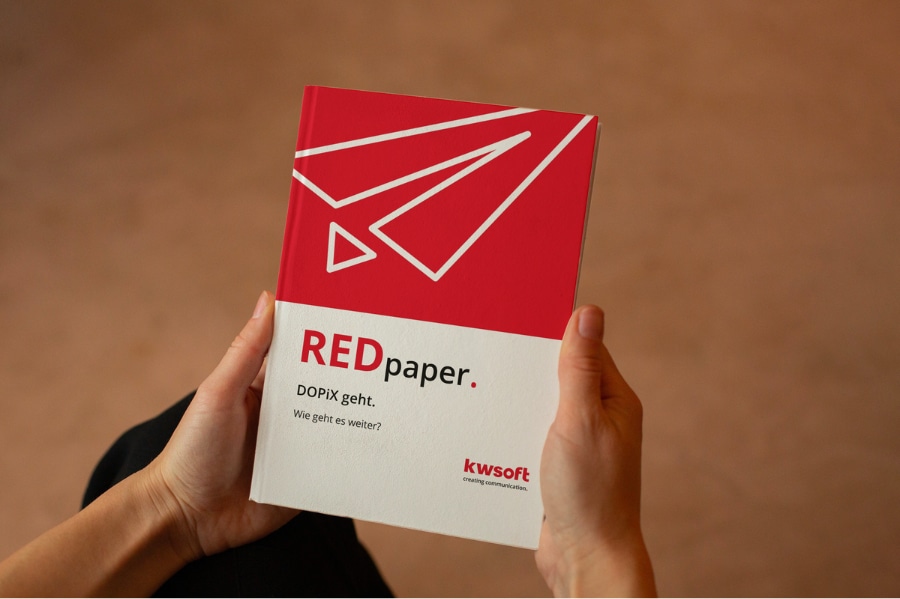 The image shows a person holding the REDpaper on “DOPiX” replacement.