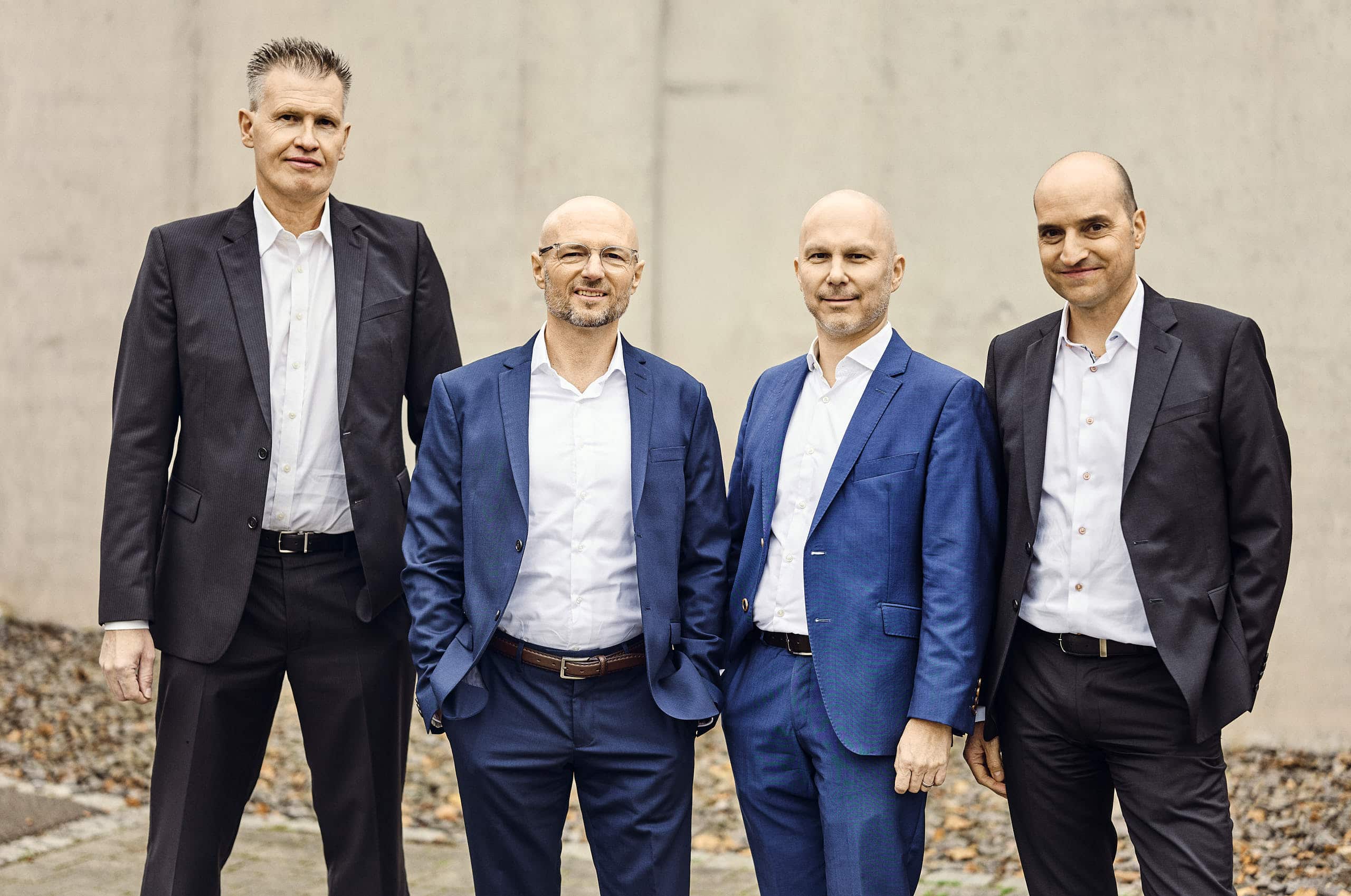 The photo shows the executive management of the kwsoft® group.